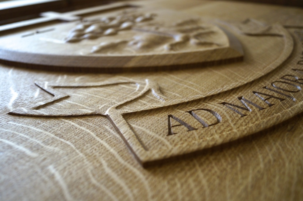 Engraved Crest in an Oak Tables from MakeMeSomethingSpecial.com