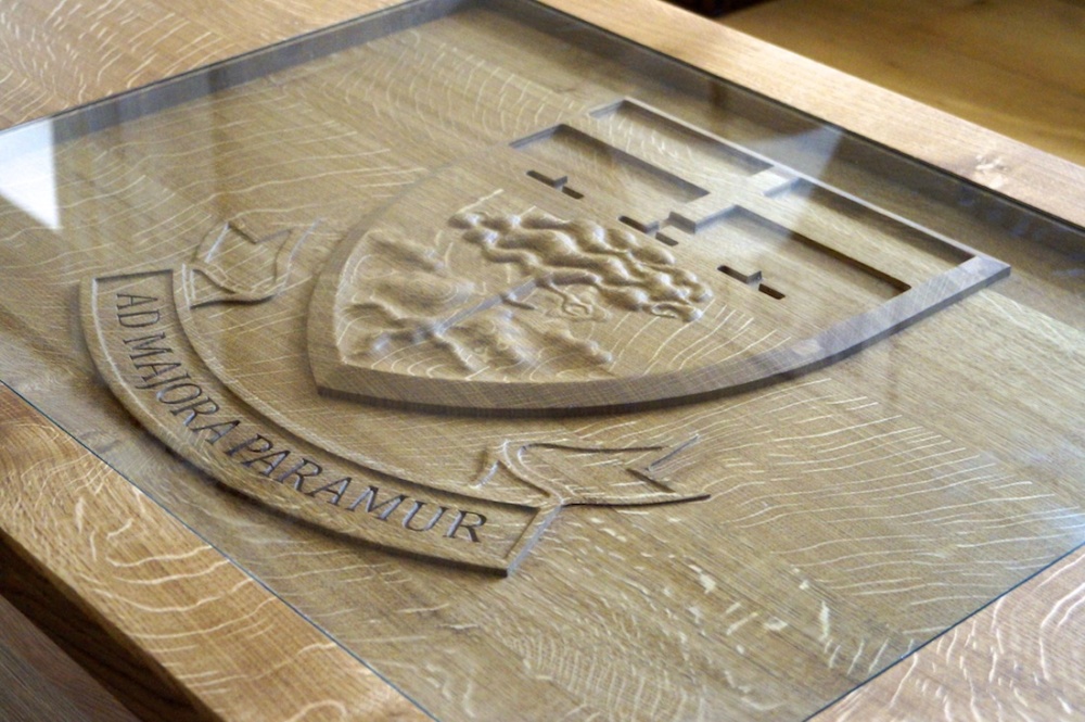 Engraved Crest in an Oak Tables from MakeMeSomethingSpecial.com