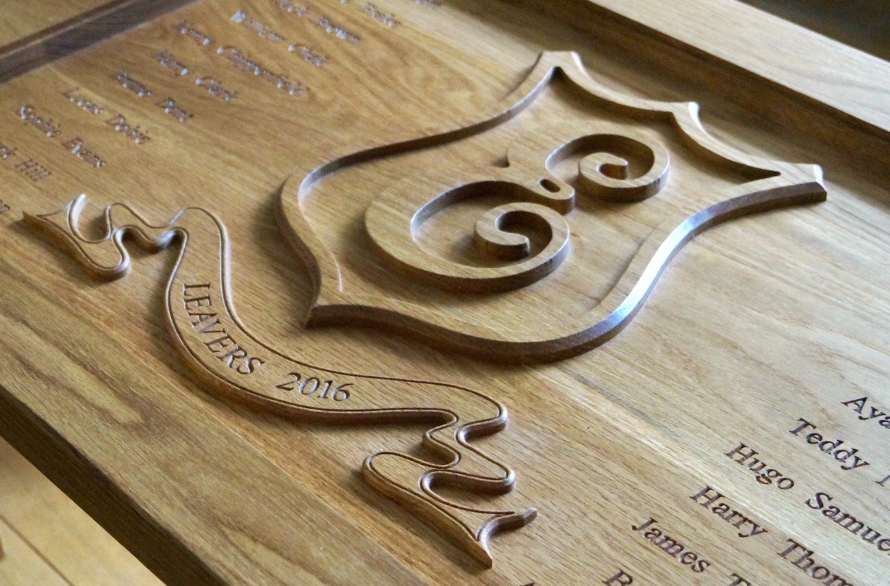Carved School Crest Onto Table