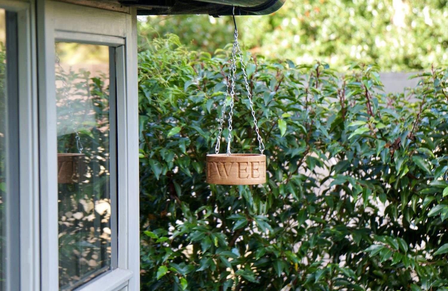 engraved-wooden-hanging-bird-feeder