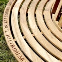 engraved-curved-teak-tree-bench
