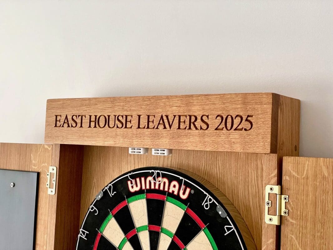 Engraved dart board cabinet